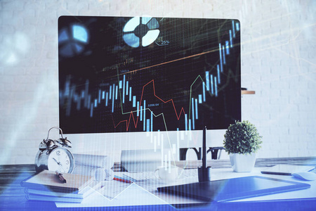 股票市场图形背景与办公桌和个人电脑。双重曝光。财务分析的概念。