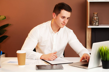 Employee works at the computer in 