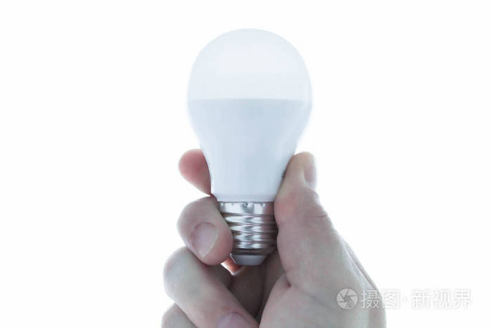 White light bulb in the hand. On a white background. 