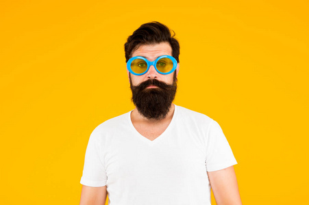 Endearing geekiness. Bearded man yellow background. Serious man 