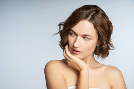 Emotional young female person posing on camera