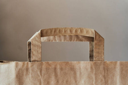 Ecofriendly paper bag. The handle of a paper bag. 