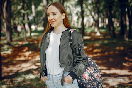 Elegant and stylish girl in a summer forest