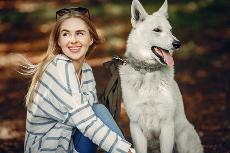 Elegant and stylish girl in a summer forest