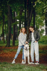 Elegant and stylish girls in a summer forest