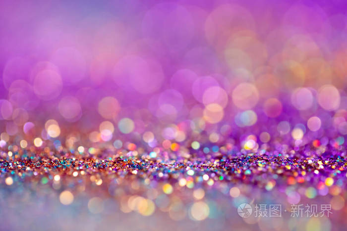 粉色,紫色和金色背景闪烁着模糊效果.