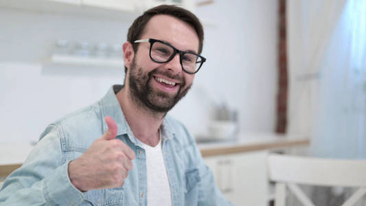 Successful Beard Young Man showing Thumbs Up 