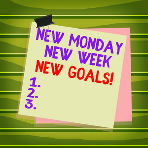 概念性手稿显示新的星期一新的星期一新的目标。商务照片文本告别周末开始新的目标目标，纸夹，彩色背景提醒备忘录。