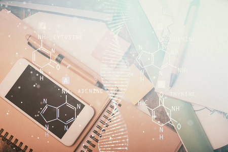 用手机在桌子上做DNA二次曝光。俯视图。科学教育观。