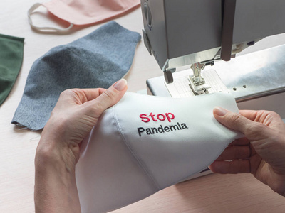 Stop Pandemia concept. Making at home protective masks. Sewing m