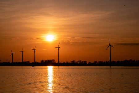 Moerdijk Netherlands, sunset winth windmills by the lake Vokerak