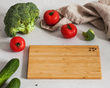  Food photo with empty cutting board for text with tomatoes, bro