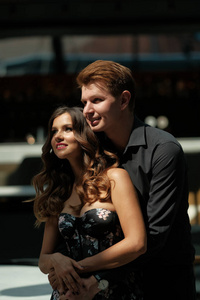 Young beautiful couple  a girl in a magnificent dress and a guy