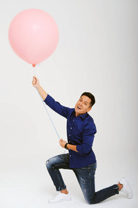 portrait of man with balloon against 