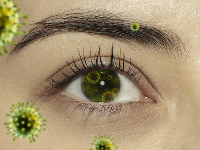 一只雌性眼睛的特写镜头，带有3D插图的冠状病毒模型，感染方式