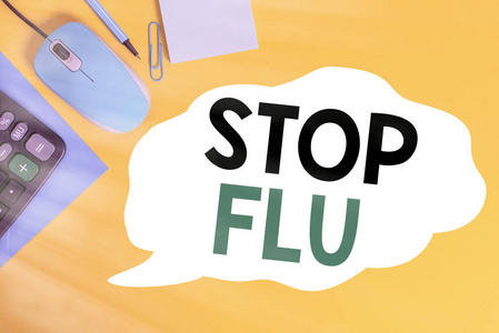 写便条显示停止流感。商业照片展示治疗由流感病毒引起的传染性呼吸道疾病封闭信封夹鼠标计算器铅笔笔记彩色背景。
