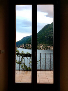 View through the window frame from the room on Lake Como 