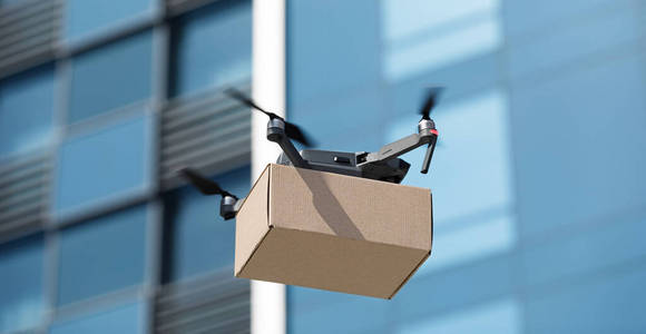 电动无人机在城市里运送小盒子图片