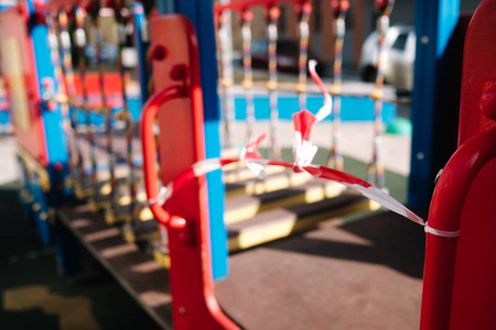  An empty playground for children in the yard. Fenced territory