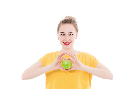 Emotional portrait of a girls who eat an apple on an isolated wh