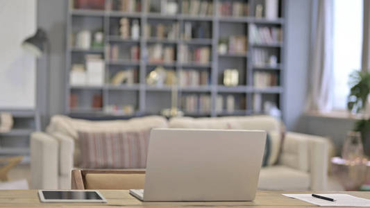 Empty Office with Open Laptop on Desk