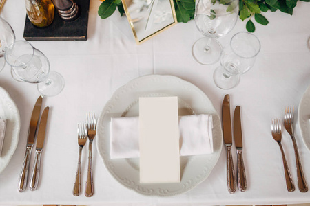 Wedding dinner table reception. The cream sheet of the menu is i