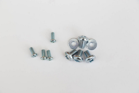 Metal screws, bolts, washers and nuts isolated on white backgrou