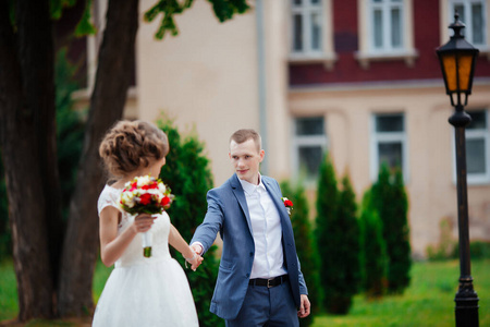 Elegant bride and groom posing together outdoors on a wedding da