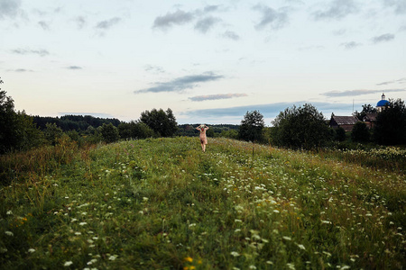  Girl running on a lush green field