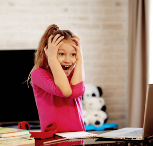 Emotional portrait of schoolgirl studying homework, home schoole