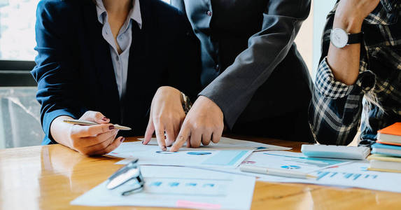 Group of business people busy discussing financial matter during