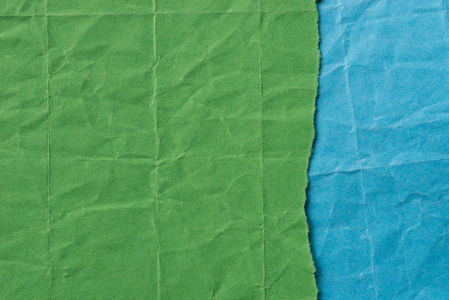 绿色和蓝色折痕纸的背景纹理图片