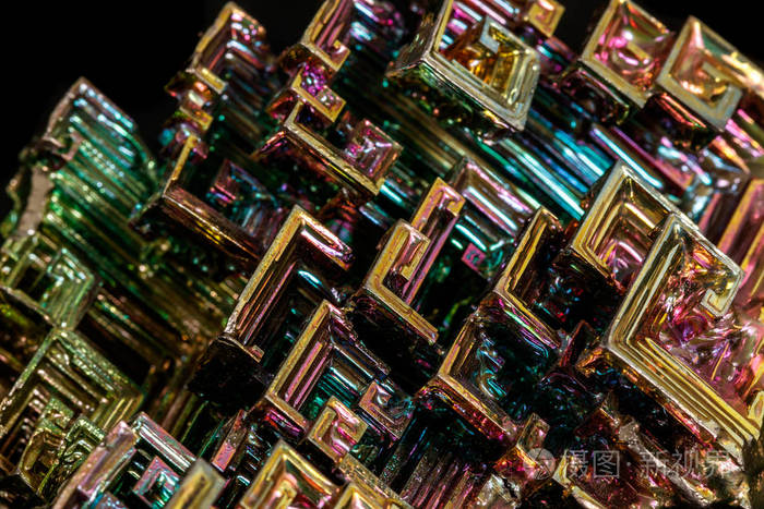 Macro of the stone bismuth mineral on a black background 