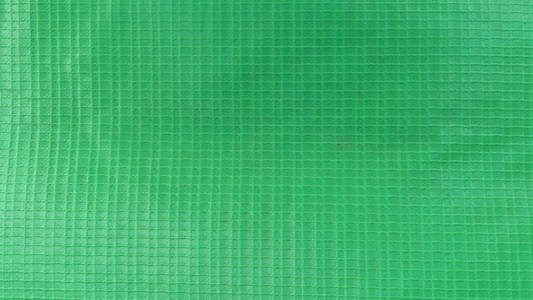亮绿色方形浮雕塑料纹理图片