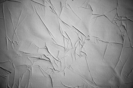 皱巴巴的折痕海报把纸张纹理弄脏了照片