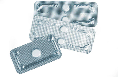 emergency contraceptive pills in blister pack on blurred backgro