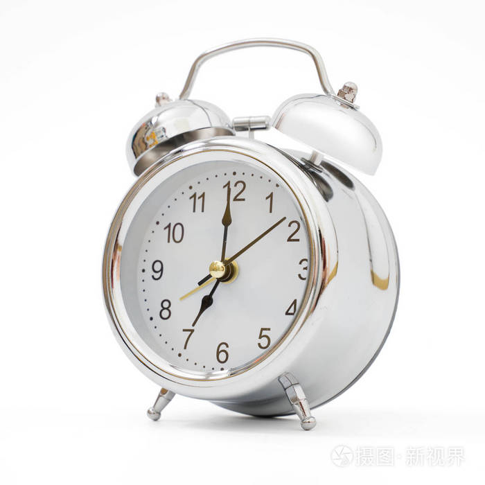 Silver retro alarm clock on isolated 