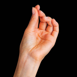 爱的小东西用两个手指拿着小东西的女人的手照片