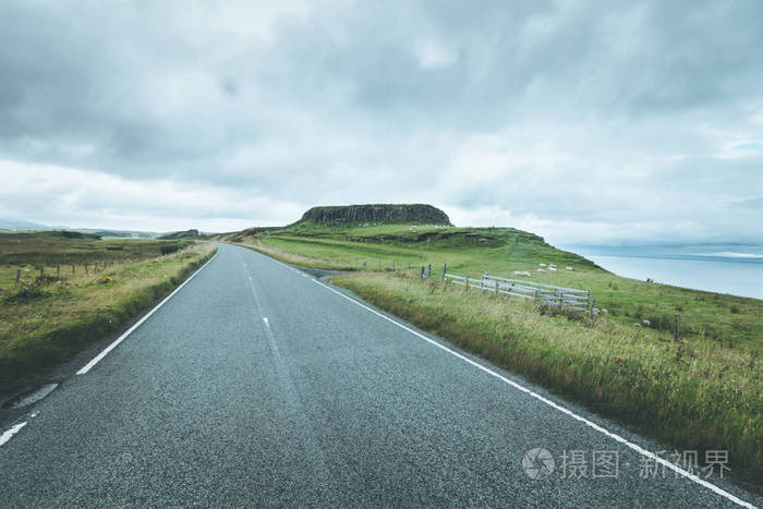 Trip or adventure Abandoned, dramatic road in Scotland, cloudy 