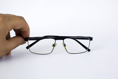 视力受损的眼镜,差眼镜与非球面散光镜头在黑框白色背景.照片