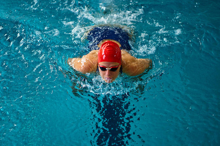 professional woman swimmer swim using breaststroke technique on