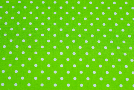 斯科特卡绿色圆点织物作为缝纫背景照片