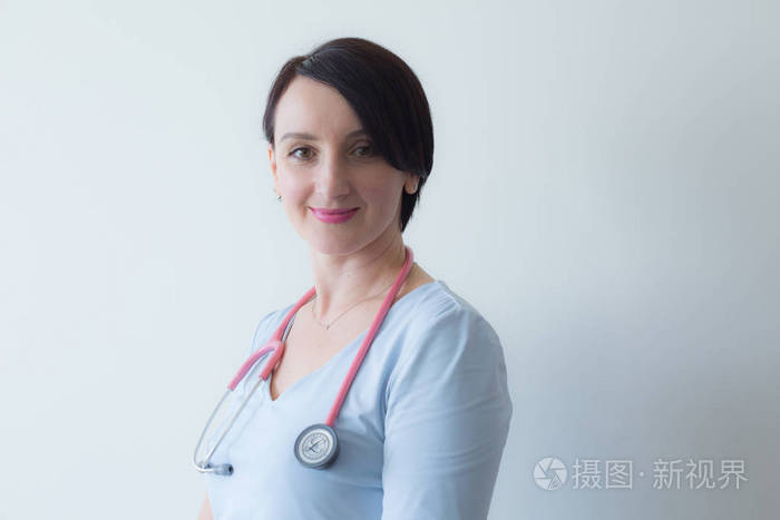 Doctor female portrait  stethoscope light blue uniform 