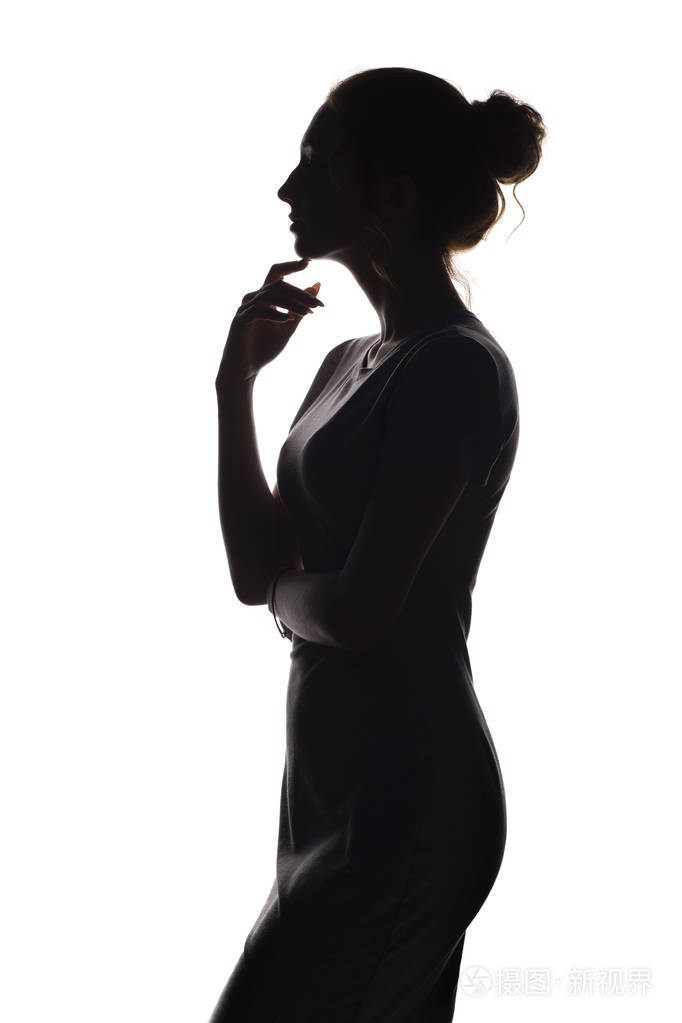 一个漂亮女孩的侧面一个白色孤立背景上的女人剪影