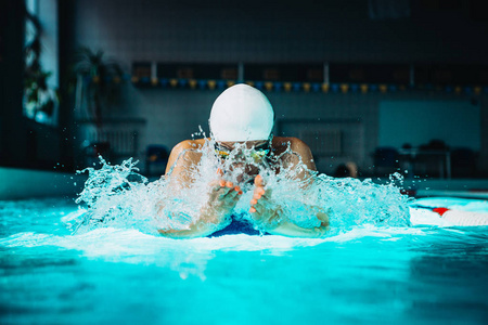 professional woman swimmer swim using breaststroke technique on