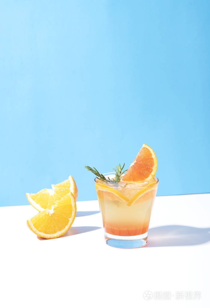 cold and refreshing orange punch cocktail with orange slice