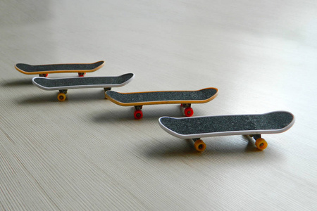 black skateboards on gray striped surface.
