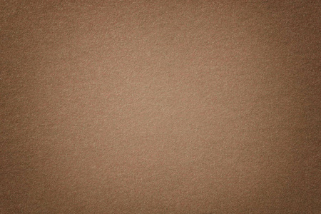 浅棕色亚光麂皮面料特写.毛毡的天鹅绒质地.照片