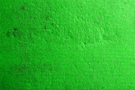 亮绿色纹理,由带有划痕和磨损的小正方形组成照片