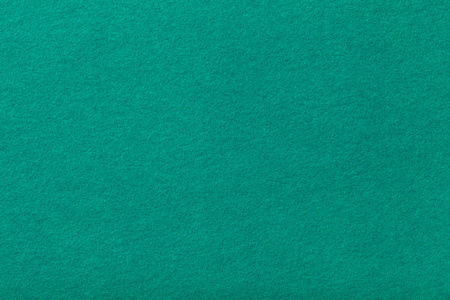 深绿松石哑光麂皮面料特写.毛毡的天鹅绒质地.照片